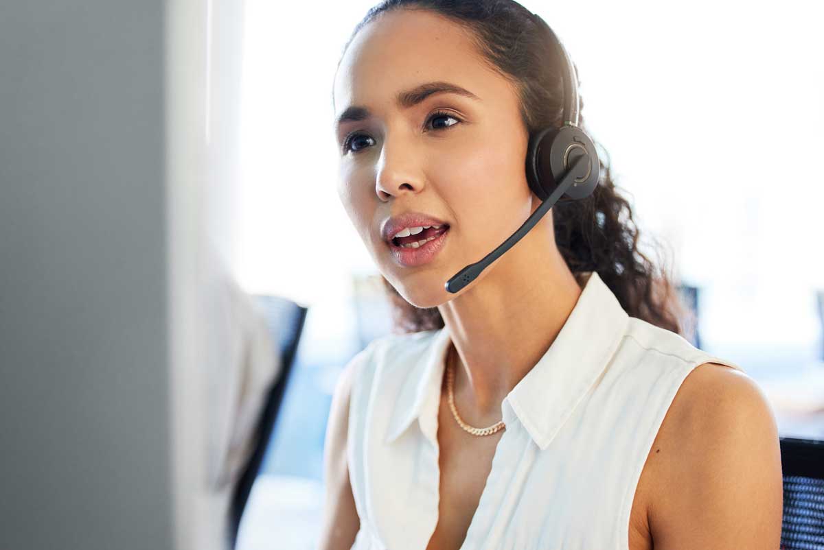 Customer service worker talks on a headset
