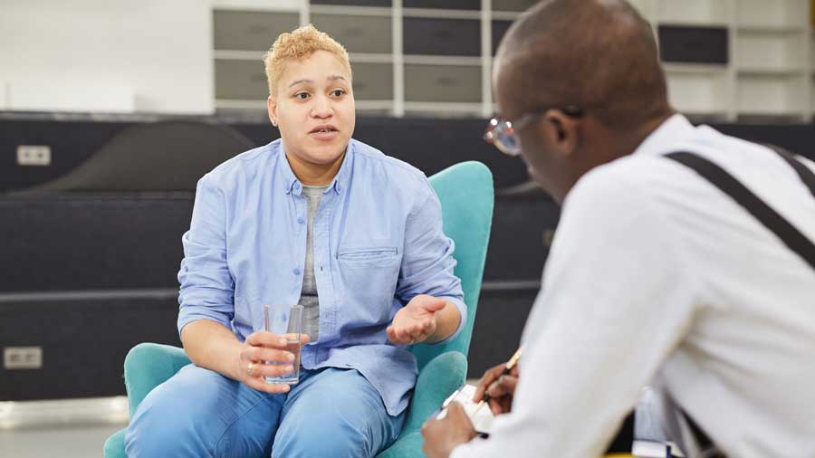 Frontline worker talks to a female client