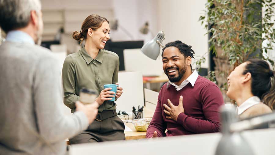 Group of diverse colleagues looking happy and relaxed