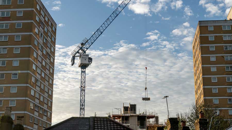 Crane lifts building materials in London