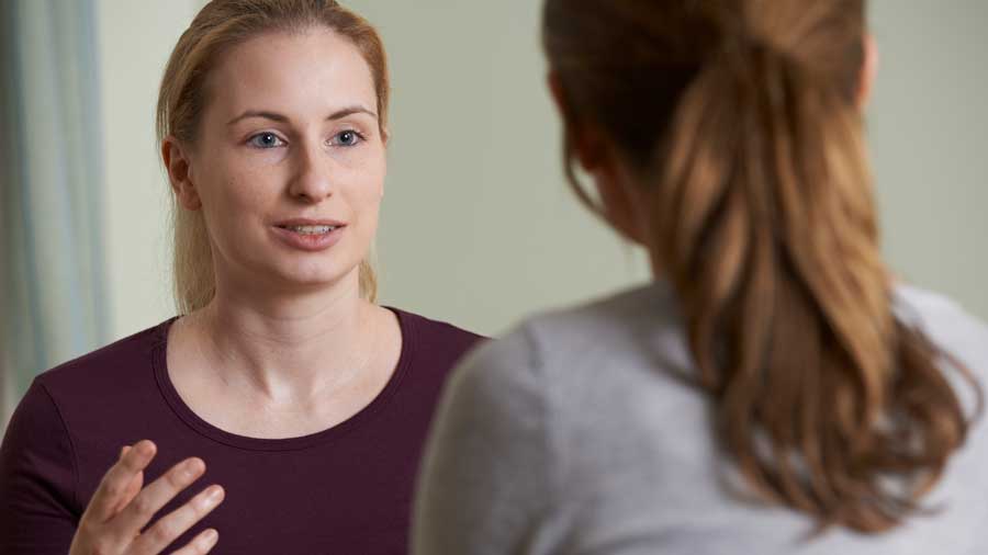 Two women talking in depth