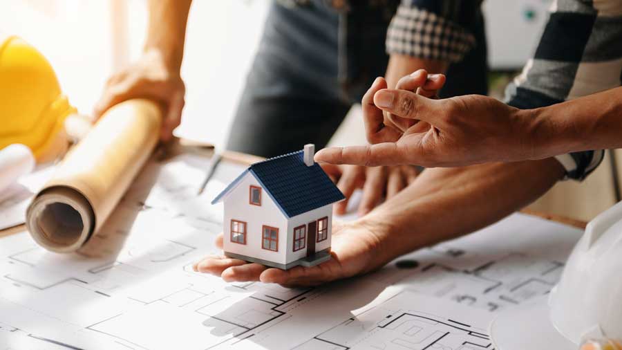 A model house on construction blueprints