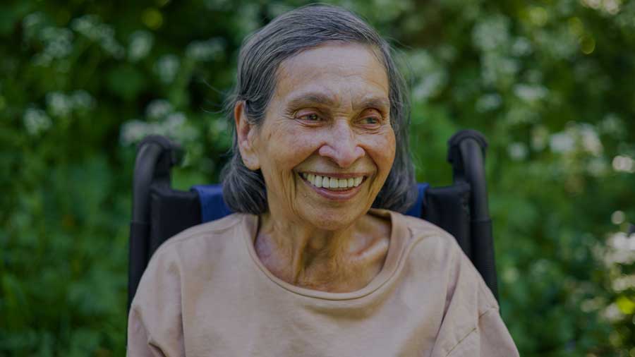 An elderly woman in a wheelchair