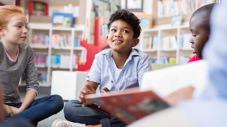 Children listen to a story in a library