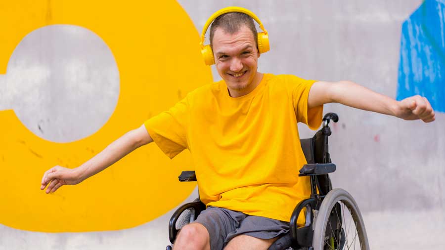 A disabled man listening to music