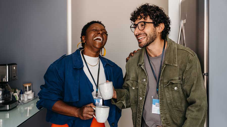 Two colleagues laughing