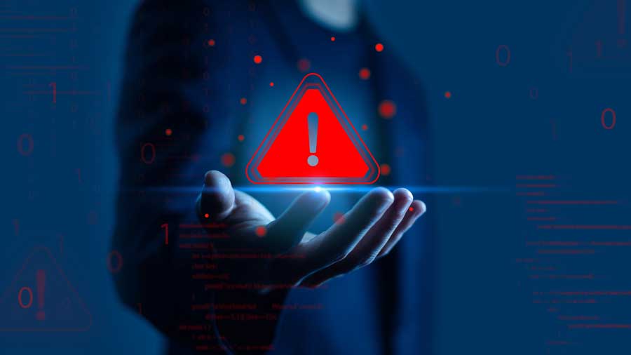 A red warning sign floats above a hand