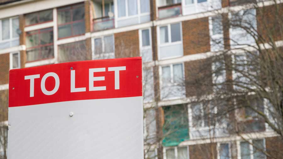 To let sign outside an apartment block