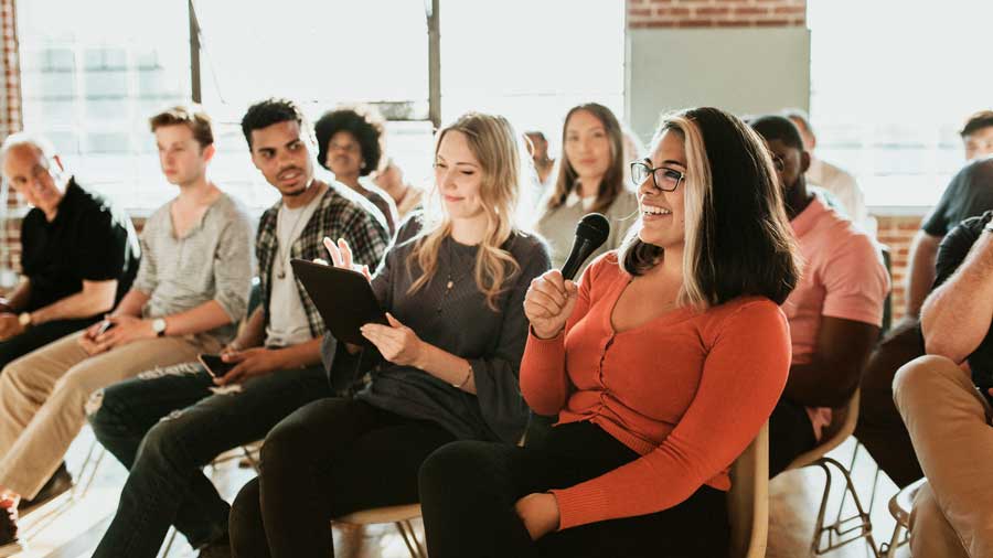 A woman speaks at a residents' meeting
