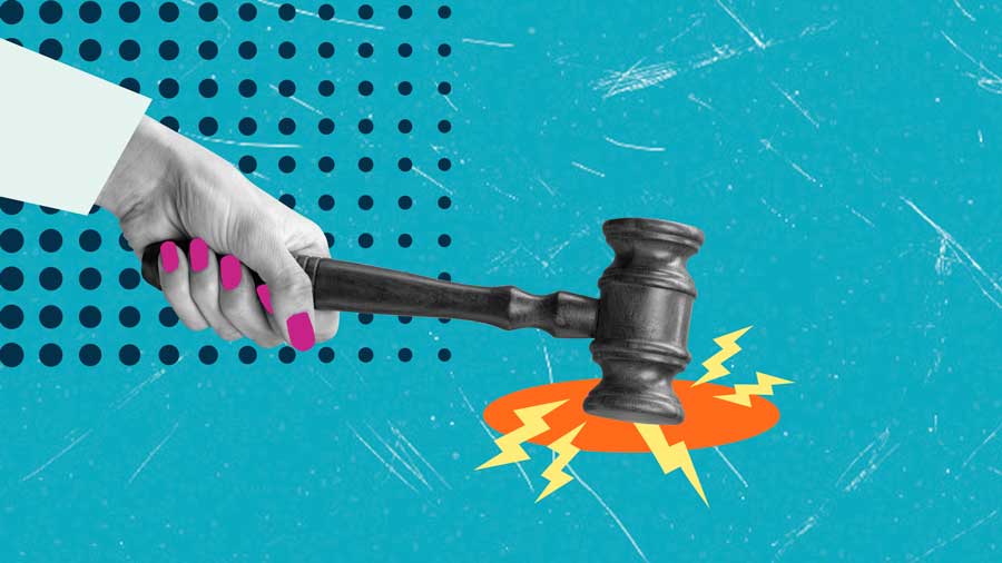 A woman's hand brings down a gavel
