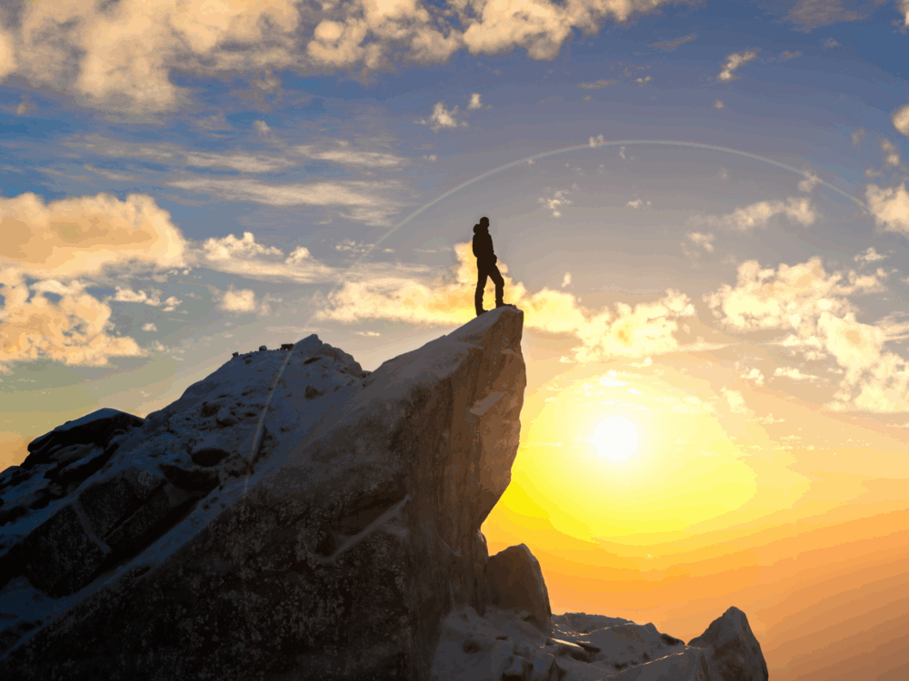 Hiker reaching mountain summit at dawn embracing freedom and victory, representing courage goal perseverance challenge growth exploration independence mindset