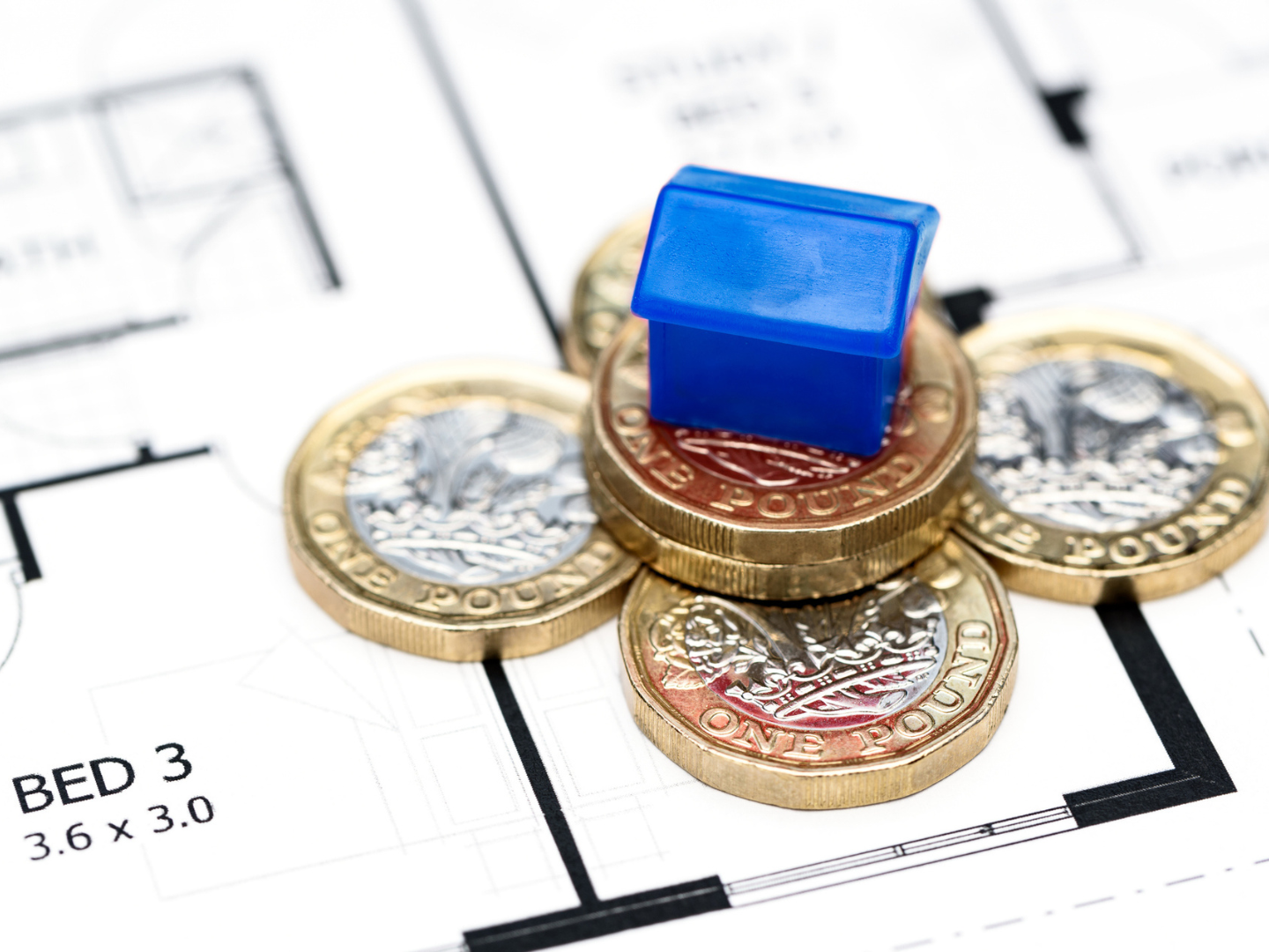 Miniature house on Pound Coins stock