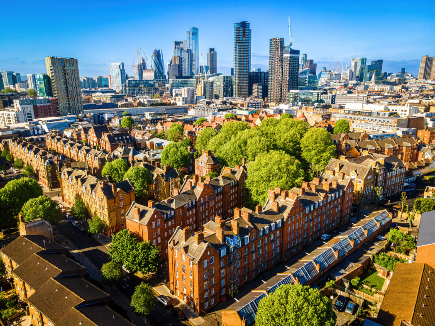 Aerial view of city of London in the distance. Social Housing in front.